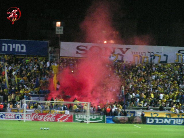 Red smoke-bomb in the 
center of Gate 11